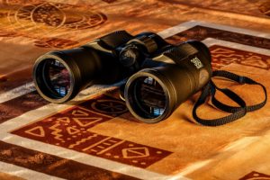 pic of binoculars representing why a client needs a life insurance agent